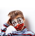 Little cute boy with facepaint like clown, pantomimic expressions close up
