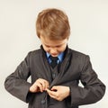 Little cute boy fastened business suit
