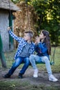 Little cute boy and girl are taking picture of themselves for selfie with phone Royalty Free Stock Photo