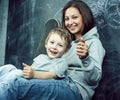 Little cute boy in glasses with young real teacher, classroom studying, lifestyle people concept Royalty Free Stock Photo