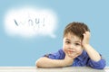 Little cute boy and his cloud of thoughts on isolated background Royalty Free Stock Photo