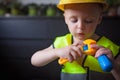 Boy with a Boss builder helmet Royalty Free Stock Photo