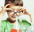 Little cute boy with medicine glass isolated wearing glasses smi Royalty Free Stock Photo