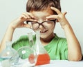 Little cute boy with medicine glass isolated wearing glasses smiling close up genius kid Royalty Free Stock Photo