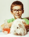 Little cute boy with medicine glass isolated wearing glasses smiling close up Royalty Free Stock Photo