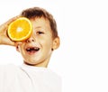 Little cute boy with orange fruit double isolated on white smiling without front teeth adorable kid cheerful Royalty Free Stock Photo