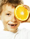 Little cute boy with orange fruit double isolated on white smiling without front teeth adorable kid cheerful Royalty Free Stock Photo