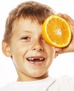 Little cute boy with orange fruit double isolated on white smiling without front teeth adorable kid cheerful Royalty Free Stock Photo