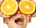 Little cute boy with orange fruit double isolated on white smiling without front teeth adorable kid cheerful Royalty Free Stock Photo