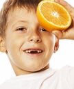 Little cute boy with orange fruit double isolated on white smiling without front teeth adorable kid cheerful Royalty Free Stock Photo