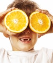 little cute boy with orange fruit double isolated on white smiling without front teeth adorable kid cheerful Royalty Free Stock Photo