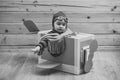 Little cute boy playing with a cardboard airplane. Royalty Free Stock Photo