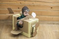 Little cute boy playing with a cardboard airplane Royalty Free Stock Photo