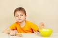 Little cute boy refuses to eat cereal Royalty Free Stock Photo