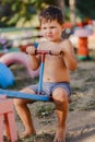 Little cute boy without a shirt plays on the Playground Royalty Free Stock Photo