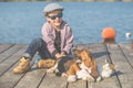 Happy boy playing with his dog and cat by the river Royalty Free Stock Photo