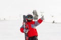 Little cute boy with skis and a ski outfit. Little skier in the Royalty Free Stock Photo