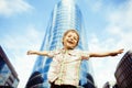 Little cute boy standing near business building, smiling happy, modern lifestyle people concept Royalty Free Stock Photo