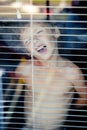 Little cute boy throught window Royalty Free Stock Photo