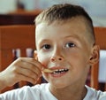 little cute boy 6 years old with hamburger and french fries maki Royalty Free Stock Photo