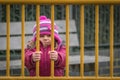 Cute girl behind bars Royalty Free Stock Photo