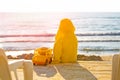 Little cute child baby boy sitting at sea on sand beach, play with toy car truck. Little kid son playing outdoors. Love Royalty Free Stock Photo