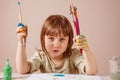 Little cute child girl painting with a brushes. Art, creativity, beauty childhood concept Royalty Free Stock Photo