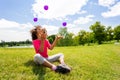 Little cute curly black beautiful girl juggle