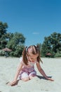 Little cute girl on beach. little girl playing in the sand.