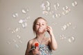 Little cute girl blowing soap bubbles Royalty Free Stock Photo