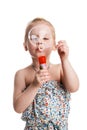 little cute girl blowing soap bubbles isolated on white background Royalty Free Stock Photo