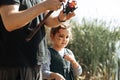 Little cute girl catching a fish with dad in the lake, river or pond Royalty Free Stock Photo