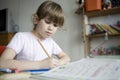 Little cute girl doing homework. Royalty Free Stock Photo