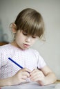 Little cute girl doing homework. Royalty Free Stock Photo