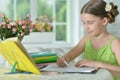 Little cute girl doing homework at home Royalty Free Stock Photo