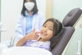 Little cute girl having teeth examined by dentist in dental clinic, teeth check-up and Healthy teeth concept Royalty Free Stock Photo