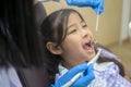 Little cute girl having teeth examined by dentist in dental clinic, teeth check-up and Healthy teeth concept Royalty Free Stock Photo