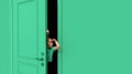 Little cute girl, kid peeking out green door with and to forehead. Playful mood, having fun. Curious kid looking with Royalty Free Stock Photo