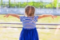 Little cute girl looking over the river from luxury ship Royalty Free Stock Photo
