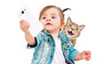 Little cute girl makes selfie with cat on phone Royalty Free Stock Photo