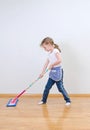 Little cute girl mopping floor. Royalty Free Stock Photo