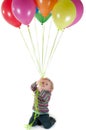 Little cute girl with multicolored air balloons Royalty Free Stock Photo