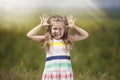 Little cute girl outdoors smiling happy in the sunlight Royalty Free Stock Photo