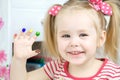 Little cute girl paints with fingers Royalty Free Stock Photo