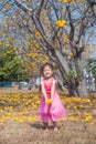 Healthy Little cute girl in pink dress with yellow flowers. Royalty Free Stock Photo