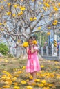 Healthy Little cute girl in pink dress with yellow flowers. Royalty Free Stock Photo