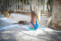 Little cute girl play with a cat on the streets of Royalty Free Stock Photo