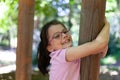 Little girl playing in the playground on a sunny summer day. Outdoor activities for children Royalty Free Stock Photo