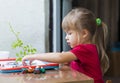 Little cute girl playing table play outside