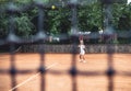 Little cute girl playing tennis outside at the tennis court Royalty Free Stock Photo